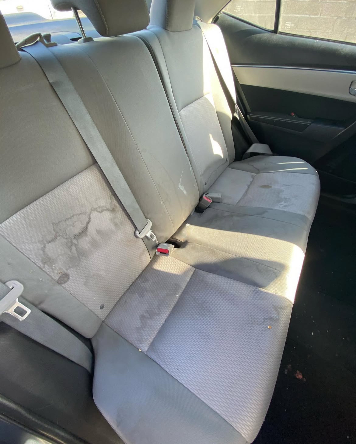 Stained car interior before cleaning